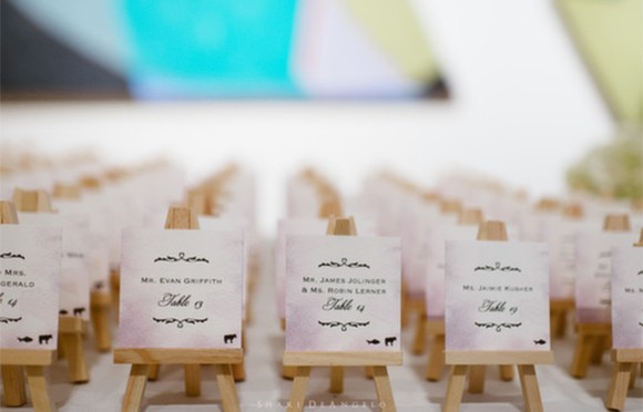 Real Wedding. Easel watercolor escort cards by Hand-Painted Weddings. Photo by Shari Angelo. Wedding planning by Truly You Events.